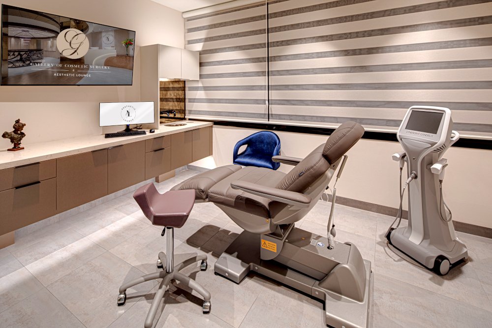 Luxury spa room with Gharieni treatment table, modern equipment, and elegant decor.