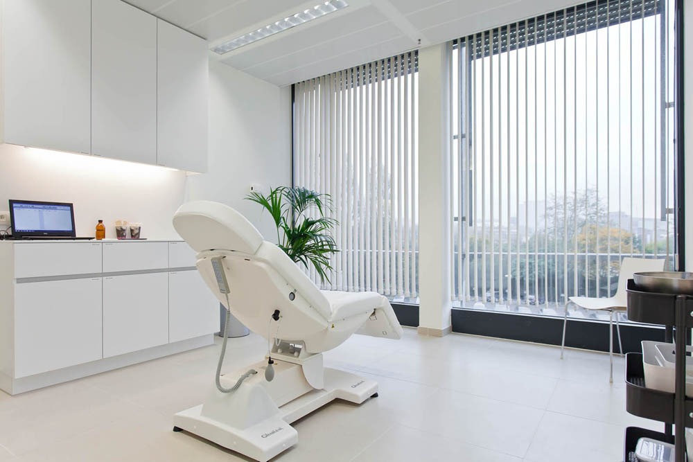 Gharieni luxury spa treatment table in modern, serene wellness clinic setting.